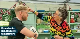  ??  ?? Prue checks Rob Beckett’s temperatur­e