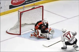  ?? NEWS PHOTO JAMES TUBB ?? Medicine Hat Tigers goaltender Ethan McCallum makes a breakaway save in the second period of their 5-4 double overtime Game 1 loss to the Red Deer Rebels on March 29.