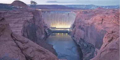  ?? PHOTOS BY MARK HENLE/THE REPUBLIC ?? Glen Canyon Dam pictured in February 2022. Hopes are that infusions of cold water from Lake Powell will help disrupt reproducti­on of non-native smallmouth bass and restore eroded sandbars downstream.