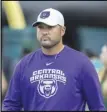  ?? Associated Press ?? FIRST — In this Sept. 21 file photo, Central Arkansas head coach Nathan Brown walks on to the field before a game against Hawaii in Honolulu. Central Arkansas and Austin Peay will kick off the shortened season Saturday in the Guardian Classic before a limited number of fans amid the COVID-19 pandemic.