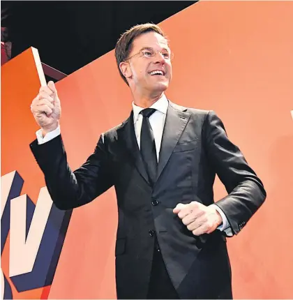  ?? Pictures / AP ?? Mark Rutte celebrates as it becomes clear his VVD party is the big winner on the night.