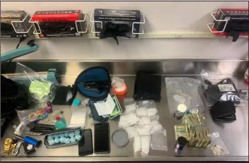  ?? WHEAT RIDGE POLICE DEPARTMENT ?? Wheat Ridge police seized methamphet­amine, 1,000 fentanyl pills and a stolen handgun during a traffic stop for expired tags on Jan. 24. A 42- year- old suspect was taken into custody.