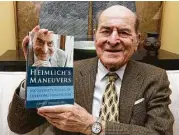  ?? Associated Press file photos ?? Dr. Henry Heimlich’s memoir, aptly titled “Heimlich’s Maneuvers,” was a point of pride for the thoracic surgeon at his home in Cincinnati in 2014.