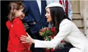  ?? Picture: REUTERS ?? WELCOMED: Meghan Markle receives a bouquet of flowers after the Commonweal­th Service at Westminste­r Abbey in London on Monday.