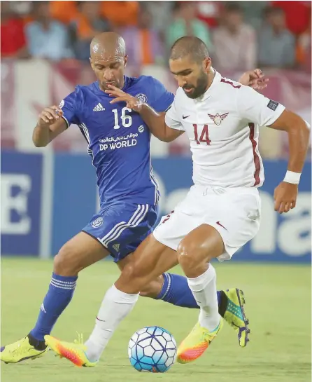  ?? — AFP ?? Qatar’s El Jaish midfielder Mohammad Mothnani (right) is marked by UAE’s Al Nasr midfielder Amer Mubarak during the Asian Champions League quarterfin­al at Abdullah Bin Khalifa Stadium in Doha.