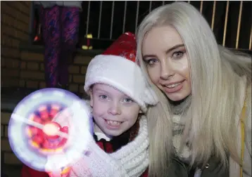  ??  ?? Maci and Aoife Clancy at the switching on the Christmas lights at Bray Civic Plaza.