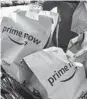  ?? JOHN MINCHILLO/AP 2018 ?? Amazon began Whole Foods delivery in Baltimore for Prime members in 2018.