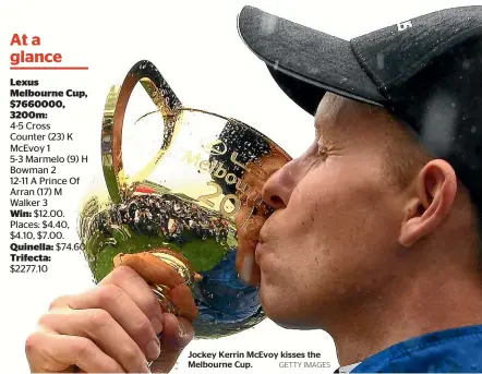  ?? GETTY IMAGES ?? Jockey Kerrin McEvoy kisses the Melbourne Cup.