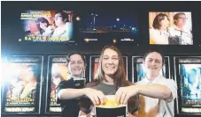  ??  ?? Coomera Anglican College students Cody Guy, Sian Callaghan and Jason Guy grab their popcorn ahead of the school’s annual film festival at Reading Cinemas Harbour Town Shopping Centre on October 18. Pictures: GLENN HAMPSON