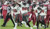  ?? RICK SCUTERI /AP ?? Tampa Bay’s William Gholston (92), who had a key fumble recovery in the Buccaneers’ OT victory at Arizona on Christmas, and his defensive teammates will face a big challenge from Carolina’s rushing attack.