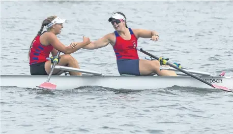  ?? JULIE JOCSAK/POSTMEDIA NEWS ?? Anna Maloney, left, and Emily Stewart of St. Catharines Rowing club win the under-19 women’s double during the fourth day of racing at the 135th Royal Canadian Henley Regatta in St. Catharines on Friday.