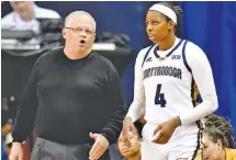  ?? STAFF PHOTO BY ROBIN RUDD ?? UTC coach Jim Foster, shown instructin­g Arianne Whitaker during Thursday’s game against Samford, is one win away from 900 for his college career as the Mocs host Mercer today.