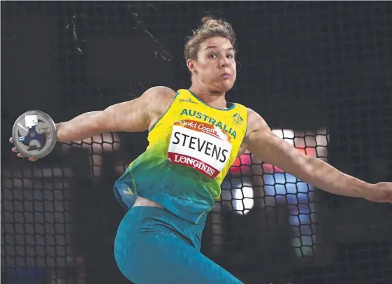  ?? Picture: AAP ?? Australia’s Dani Stevens blitzed the women's discus throw final at Carrara Stadium, setting a new Commonweal­th Games record of 68.26m.