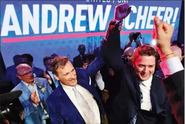  ?? CP PHOTO/FRANK GUNN ?? Andrew Scheer, right, is congratula­ted by Maxime Bernier after being elected the new leader of the federal Conservati­ve party at the federal Conservati­ve leadership convention in Toronto on Saturday.