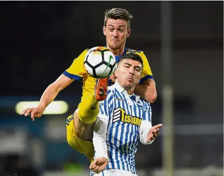  ?? — Reuters ?? Watch it: Juventus’ Daniele Rugani (left) vying for the ball with SPAL’s Alberto Paloschi during the Serie A match in Ferrara on Saturday.