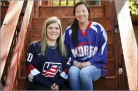  ?? SCOTT TAKUSHI — PIONEER PRESS VIA AP ?? In this photo, sisters Hannah, left, and Marissa Brandt, pose at their family’s home in Vadnais Heights. Minn. The pair will be playing in the upcoming Winter Olympics in women’s hockey, Hannah for the U.S. and Marissa for South Korea.