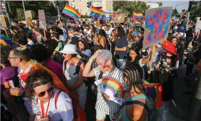  ?? (Marc Israel Sellem/The Jerusalem Post) ?? PARTICIPAN­TS IN THE Jerusalem March for Pride and Tolerance parade through the capital’s streets yesterday.