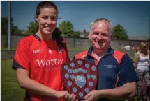  ??  ?? Mattock Rangers captain Rachel Kane receives the Louth Ladies Division 2 trophy from Dermot Woods. Picture: Warren Matthews
