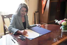  ?? — AFP photo ?? Pelosi signs H.J. Res 46, relating to a national emergency declared by Trump, after the US Senate voted on the bill 59-41, on Capitol Hill in Washington, DC.