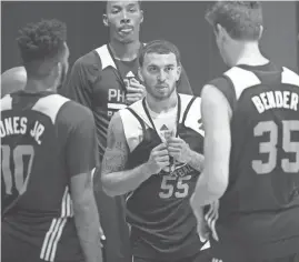  ?? MICHAEL CHOW/AZCENTRAL SPORTS ?? Suns guard Mike James (55) huddles with teammates during practice at Talking Stick Resort Arena on Wednesday. The team is preparing for the NBA Summer League in Las Vegas.