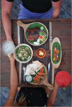  ??  ?? Clockwise from the top: Pork Ribs, Tuna Sashimi, Eggplant Moussaka, Ubud ultra green bowl,