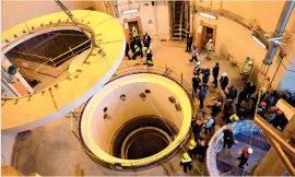  ?? AP file ?? BURNING ISSUE: Technician­s work at the Arak heavy water reactor’s secondary circuit, as officials and media visit the site, near Arak, 250km from Tehran. —