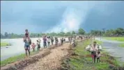  ?? NYT FILE PHOTO ?? Rohingya refugees near the Naf River separating Myanmar and Bangladesh, after they crossed the border.