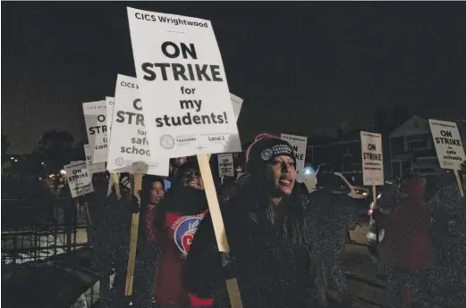  ?? TYLER LARIVIERE/SUN-TIMES FILE ?? Stacy Davis Gates pickets alongside educators during a charter school strike this year.