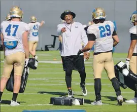  ?? Steve Galluzzo For The Times ?? KEN NORTON JR. was a star for UCLA in the 1980s and now he’s back as a leader on the coaching staff, laying out clear expectatio­ns for his defensive players.