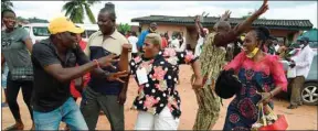  ??  ?? Party supporters dance to celebrate candidate of People’s Democratic Party (PDP) Godwin Obaseki’s victory at a ward after the Edo State governorsh­ip elections in Benin City, Midwestern Nigeria, yesterday.