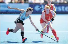  ??  ?? Fighting hard: England’s Nicola White (right) battles for possession with Martina Carvallo