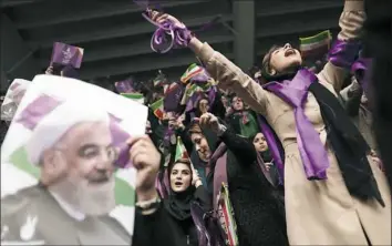  ?? Behrouz Mehri/AFP/Getty Images ?? Supporters of Hassan Rouhani, Iranian president and candidate in the upcoming elections, attend a campaign rally Wednesday in the northweste­rn city of Ardabil.