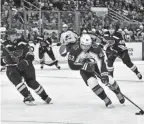  ?? JEFF CURRY/USA TODAY SPORTS ?? Avalanche left wing Artturi Lehkonen (62) controls the puck against Blues defenseman Justin Faulk (72) during the first period in Game 3 on Saturday in St. Louis.