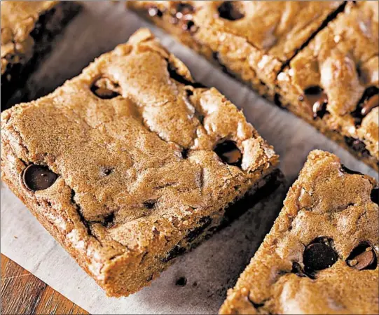  ?? DREAMSTIME ?? Blondies are easy to make, and kids will have fun baking them. Try different variations using white chocolate or butterscot­ch chips, chopped pieces of toffee or other candy.