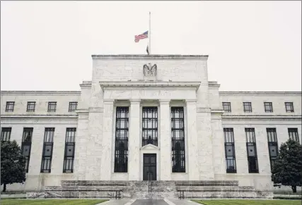  ?? Patrick Semansky / Associated Press ?? The Federal Reserve building is viewed on May 22 in Washington. The Federal Reserve’s $500 million shortterm borrowing program has largely been left untouched despite many municipali­ties across the country facing major budget shortfalls.