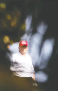  ?? MARCO BELLO/REUTERS ?? Former U.S. president Donald Trump looks on at the Trump Internatio­nal Golf Club in Florida on Monday.