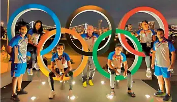  ?? —
SAI ?? Members of the Indian women’s boxing team pose near the Olympic rings in Tokyo on Wednesday ahead of the Olympic Games.