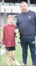  ?? ?? Matthew Counihan receives his INTO Mini-7’s Skills prize from Cork GDA Paudie O’Brien.