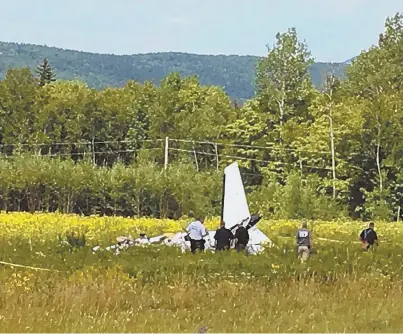  ?? AP PHOTO ?? FATAL: Authoritie­s in Maine investigat­e at the scene of a twin-engine plane crash near Greenville Municipal Airport in Greenville, Maine, yesterday that left three dead.