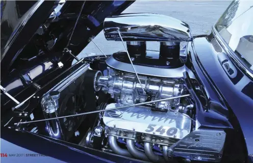  ??  ?? BELOW. THE HIGHLY POLISHED SCOOP POKING THROUGH THE HOOD LETS YOU KNOW THERE IS SOMETHING AWESOME UNDERNEATH. THE SUPERCHARG­ED MERLIN 540-CI ALLALUMINU­M V-8 SENDS A PAVEMENT-MELTING 880 HP TO THE TURBO TH400 THREE-SPEED AUTO. JUDICIOUS USE OF THE...