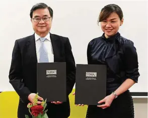  ??  ?? First City Corporatio­n director Tan Sri Dr Teo Chiang Liang and CIMA South-East Asia markets manager Malaysia Ginny Lim attending the MoU signing ceremony.