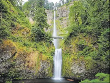  ?? Getty Images ?? Multnomah Falls is one of dozens of waterfalls in the Columbia River Gorge.