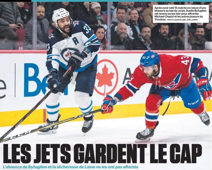  ?? PHOTO AGENCE QMI, JOËL LEMAY ?? Après avoir raté 15 matchs en raison d’une blessure au bas du corps, Dustin Byfuglien est revenu au jeu hier pour affronter Michael Chaput et les autres joueurs du Tricolore.