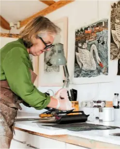  ??  ?? Holding the cutting tool steady, Angela gouges out her design on the lino surface (top).
The ink is spread over the finished design using a hand roller, ready for printing (above).