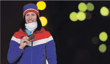  ?? MADDIE MEYER GETTY IMAGES ?? Marit Bjorgen with her gold medal in cross-country skiing at Olympic Stadium in February. The 38-year-old won five medals in Pyeongchan­g.