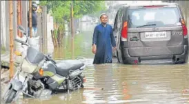  ??  ?? After the downpour on Wednesday, water entered several hoses in Patel Nagar. (Below) Waterlogge­d roads in Dblock of Indira Nagar gave commuters a tough time.