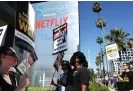  ?? Tama/Getty Images ?? Sag-Aftra members walk the picket line in solidarity with striking WGA members outside the Netflix offices on 13 July 2023 in Los Angeles, California. Photograph: Mario
