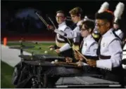  ?? ERIC BONZAR — THE MORNING JOURNAL ?? The Avon Lake High School Marching Band’s percussion line performs Sept. 8, during the Shoremen’s road game against the Avon Eagles.