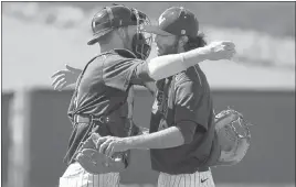  ?? ERIK VERDUZCO/ LAS VEGAS REVIEW-JOURNAL ?? UNLV catcher Erik VanMeetren, left, and reliever Brayden Torres embrace after Torres got the final out of a 6-5 Mountain West victory over Air Force at Wilson Stadium on Sunday.