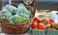  ?? DIGITAL FIRST MEDIA FILE PHOTO ?? Greens and tomatoes are on sale during an outdoors farmers market in Pottstown. Sustainabl­e eating is expected to be one of the food trends of 2017which includes eating seasonally and locally.